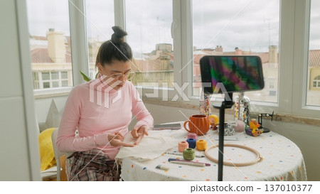 Asian woman creator filming Halloween craft livestream 137010377