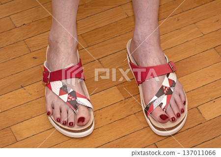 Female feet in open toe sandals Female feet in open toe sandals 137011066