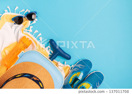 Children's beach essentials including a hat, sunglasses, water shoes, suitcase, and towel. 137011708