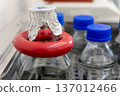 Laboratory Bottles with Samples in Incubator for Microbiological Testing 137012466
