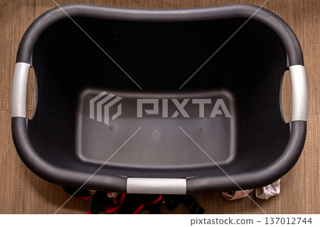 Empty plastic laundry basket 137012744