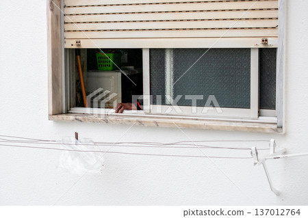 Hand Reaching Out of a Window Hand Reaching Out of a Window 137012764