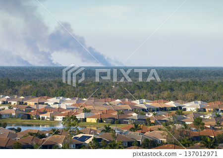 Suburban neighborhood in Florida suffering from bad air quality polluted with prescribed forest fire smoke Suburban neighborhood in Florida suffering from bad air quality polluted with prescribed forest fire smoke 137012971
