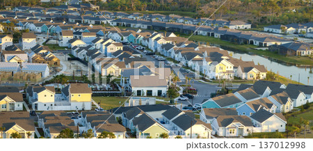 Construction in new developing suburban area. Development of residential housing in American suburbs. Real estate market in the USA Construction in new developing suburban area. Development of residential housing in American suburbs. Real estate market in the USA 137012998