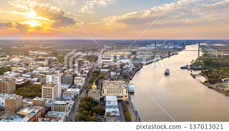 Savannah, Georgia. Famous historic River Street with waterfront tourist attractions. USA cityscape at sunset 137013021