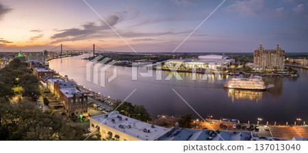 Savannah, Georgia. Famous historic River Street with waterfront tourist attractions. USA cityscape at sunset 137013040