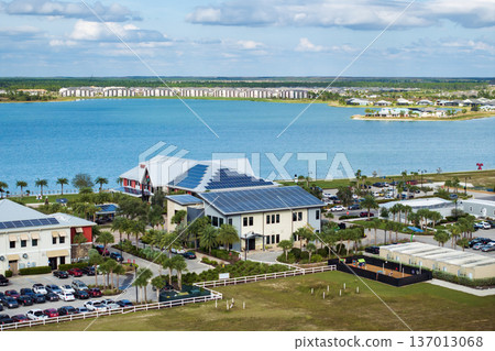 Photovoltaic panels for producing clean ecological electric energy. Florida office buildings with solar roofs. Renewable electricity with zero emission concept 137013068