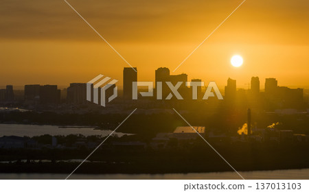 Aerial view of downtown district of Tampa city in Florida, USA at sunset. Dark silhouette of high skyscraper office buildings in modern american midtown Aerial view of downtown district of Tampa city in Florida, USA at sunset. Dark silhouette of high skyscraper office buildings in modern american midtown 137013103