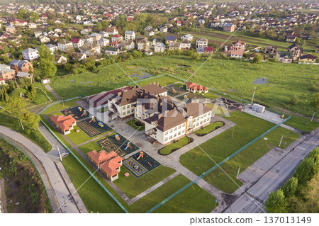 Aerial view of new prescool building in residential rural area. Aerial view of new prescool building in residential rural area. 137013149