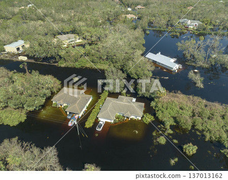 Aftermath of natural disaster. Flooded houses by hurricane Ian rainfall in Florida residential area 137013162