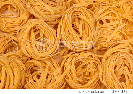Raw wheat pasta pile Raw wheat pasta pile 137013251