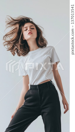 Casual lifestyle photograph with motion, Model with flowing hair in relaxed setting, Studio portrait showcasing vibrant attitude and dynamic movement in casual attire 137013541