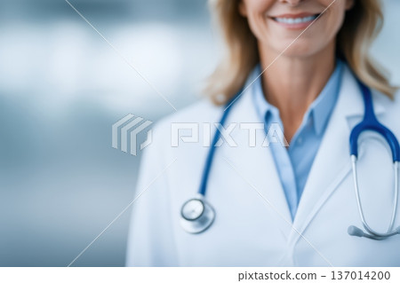 A Smiling Female Doctor Dressed in a White Coat is Wearing a Stethoscope Around Her Neck A Smiling Female Doctor Dressed in a White Coat is Wearing a Stethoscope Around Her Neck 137014200