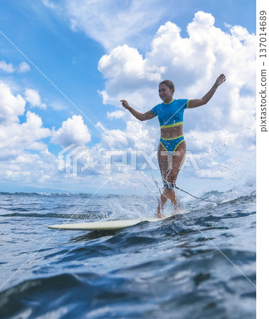 Female Instructor Showing How To Ride Waves With Enthusiasm And Movement Female Instructor Showing How To Ride Waves With Enthusiasm And Movement 137014689
