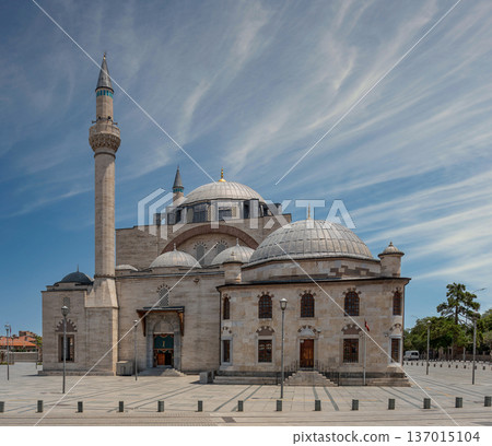 Selimiye Mosque with its towering minaret and domes under a blue sky with wispy clouds in Konya Turkey 137015104