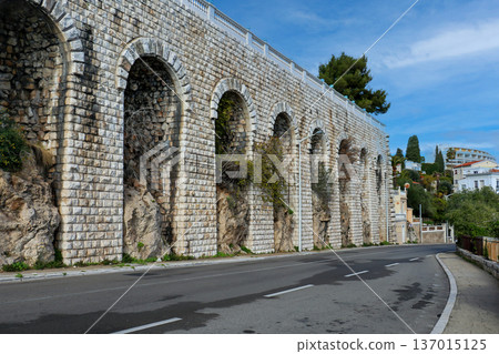 Road next to stone wall Road next to stone wall 137015125