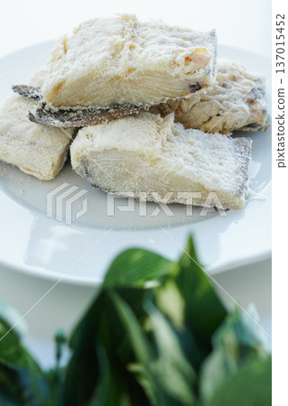 Spanish cuisine ingredient: salted and dried cod (bacalao) close-up on white background 137015452