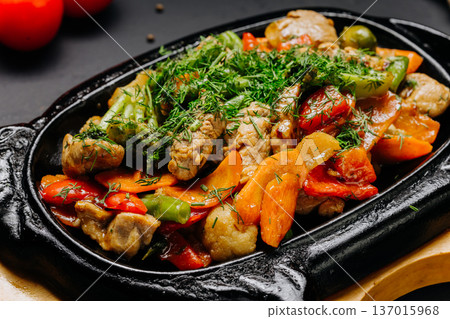 Roasted chicken with vegetables in cast iron pan rustic gourmet dinner Roasted chicken with vegetables in cast iron pan rustic gourmet dinner 137015968