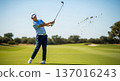 A high-action, professional sports photograph capturing a dynamic moment in a game of Golf. The image clearly shows a player making in sharp focus 137016243