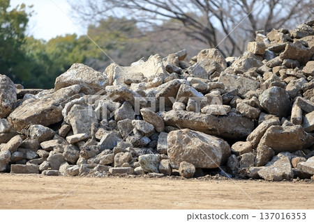 Piles of concrete rubble at a demolition site 137016353