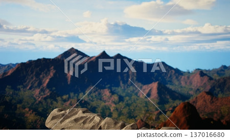 Panoramic view of a stunning mountain range with rocky terrain in the foreground. Perfect for adventure seekers looking for an extreme hiking experience in the heart of untouched wilderness. Panoramic view of a stunning mountain range with rocky terrain in the foreground. Perfect for adventure seekers looking for an extreme hiking experience in the heart of untouched wilderness. 137016680