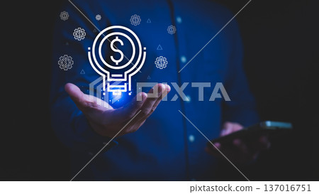 Glowing money idea icon with a light bulb on hand, symbolizing financial creativity, business innovation, smart investment, economic growth, digital finance, and profitable strategy. Glowing money idea icon with a light bulb on hand, symbolizing financial creativity, business innovation, smart investment, economic growth, digital finance, and profitable strategy. 137016751