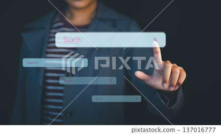 Person tapping a digital search bar interface, representing online browsing, data finding, and modern technology interaction for web research, SEO concepts, and futuristic UI innovation. Person tapping a digital search bar interface, representing online browsing, data finding, and modern technology interaction for web research, SEO concepts, and futuristic UI innovation. 137016777