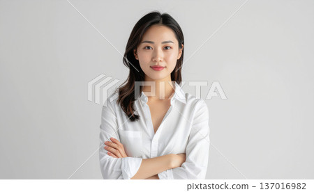Young woman with arms folded 137016982