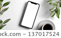 Smartphone Mockup with Coffee and Greenery on White Surface 137017524