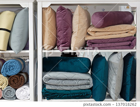 Pillows and other bedding accessories in shelf Pillows and other bedding accessories in shelf 137018262