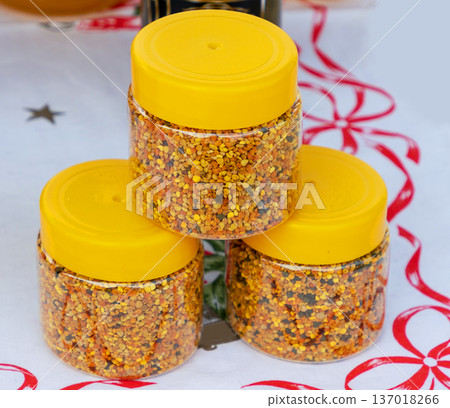 Beee polen granules in plastic containers Beee polen granules in plastic containers 137018266