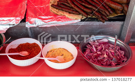 Spices served with grilled sausages 137018277