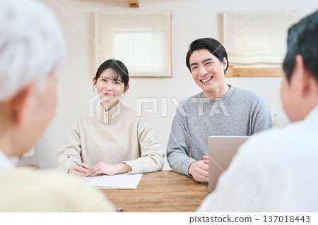 Asian family discussing their future Asian family discussing their future 137018443