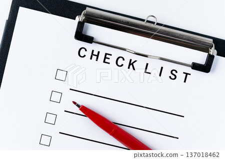 Checklist paper and red pen in a binder Checklist paper and red pen in a binder 137018462