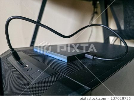 External hard drive for storing large amounts of information. Additional electronic data storage device. High quality photo External hard drive for storing large amounts of information. Additional electronic data storage device. High quality photo 137019735