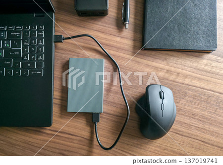 External hard drive for storing large amounts of information. Additional electronic data storage device. High quality photo External hard drive for storing large amounts of information. Additional electronic data storage device. High quality photo 137019741