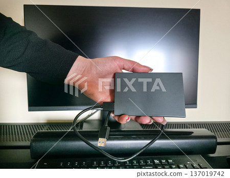 External hard drive for storing large amounts of information. Additional electronic data storage device. High quality photo External hard drive for storing large amounts of information. Additional electronic data storage device. High quality photo 137019742