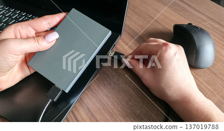 External hard drive for storing large amounts of information. Additional electronic data storage device. High quality photo 137019788