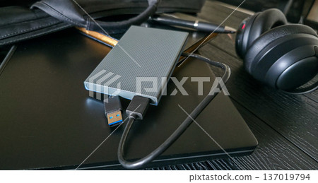 External hard drive for storing large amounts of information. Additional electronic data storage device. High quality photo External hard drive for storing large amounts of information. Additional electronic data storage device. High quality photo 137019794