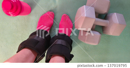Foot and forearm weights for sports. Exercise weights. Sports accessories. Healthy lifestyle. High quality photo 137019795