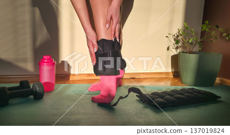 Foot and forearm weights for sports. Exercise weights. Sports accessories. Healthy lifestyle. High quality photo 137019824