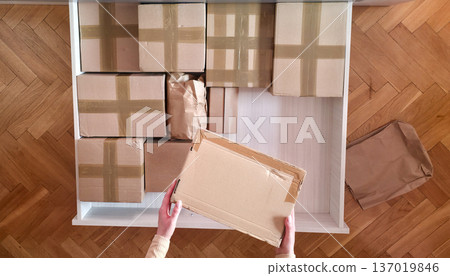 Cardboard boxes for storing and packing things. Organizing things in the house and when moving. High quality photo Cardboard boxes for storing and packing things. Organizing things in the house and when moving. High quality photo 137019846