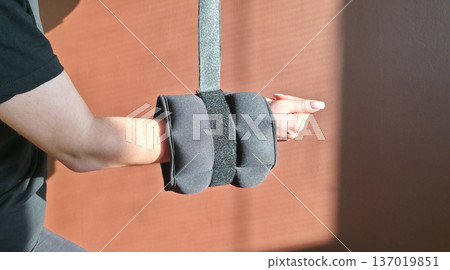 Foot and forearm weights for sports. Exercise weights. Sports accessories. Healthy lifestyle. High quality photo Foot and forearm weights for sports. Exercise weights. Sports accessories. Healthy lifestyle. High quality photo 137019851