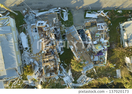 Property damage from strong hurricane winds. Mobile homes in Florida residential area with destroyed rooftops. Consequences of natural disaster 137020173