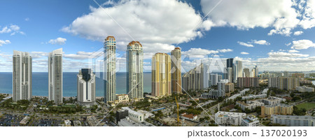 Expensive highrise hotels and condos on Atlantic ocean shore in Sunny Isles Beach city. American tourism infrastructure in southern Florida 137020193