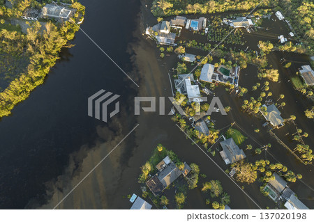 Aftermath of natural disaster. Surrounded by hurricane Ian rainfall flood waters homes in Florida residential area 137020198