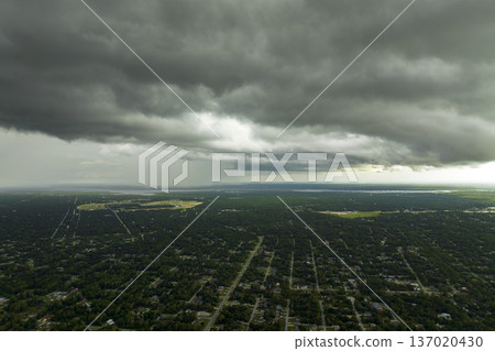 Tropical thunderstorm precipitation falling down on Florida town. Rain shower in summer Tropical thunderstorm precipitation falling down on Florida town. Rain shower in summer 137020430