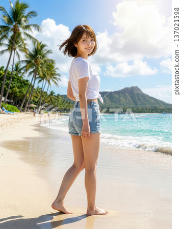 Woman in summer clothes standing on a Hawaiian beach 137021598