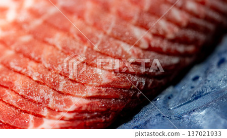 The delicate marbling of bright red frozen pork slices The delicate marbling of bright red frozen pork slices 137021933