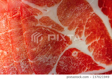 The delicate marbling of bright red frozen pork slices The delicate marbling of bright red frozen pork slices 137021949